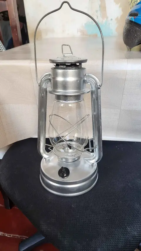 Metal storm lantern with glass