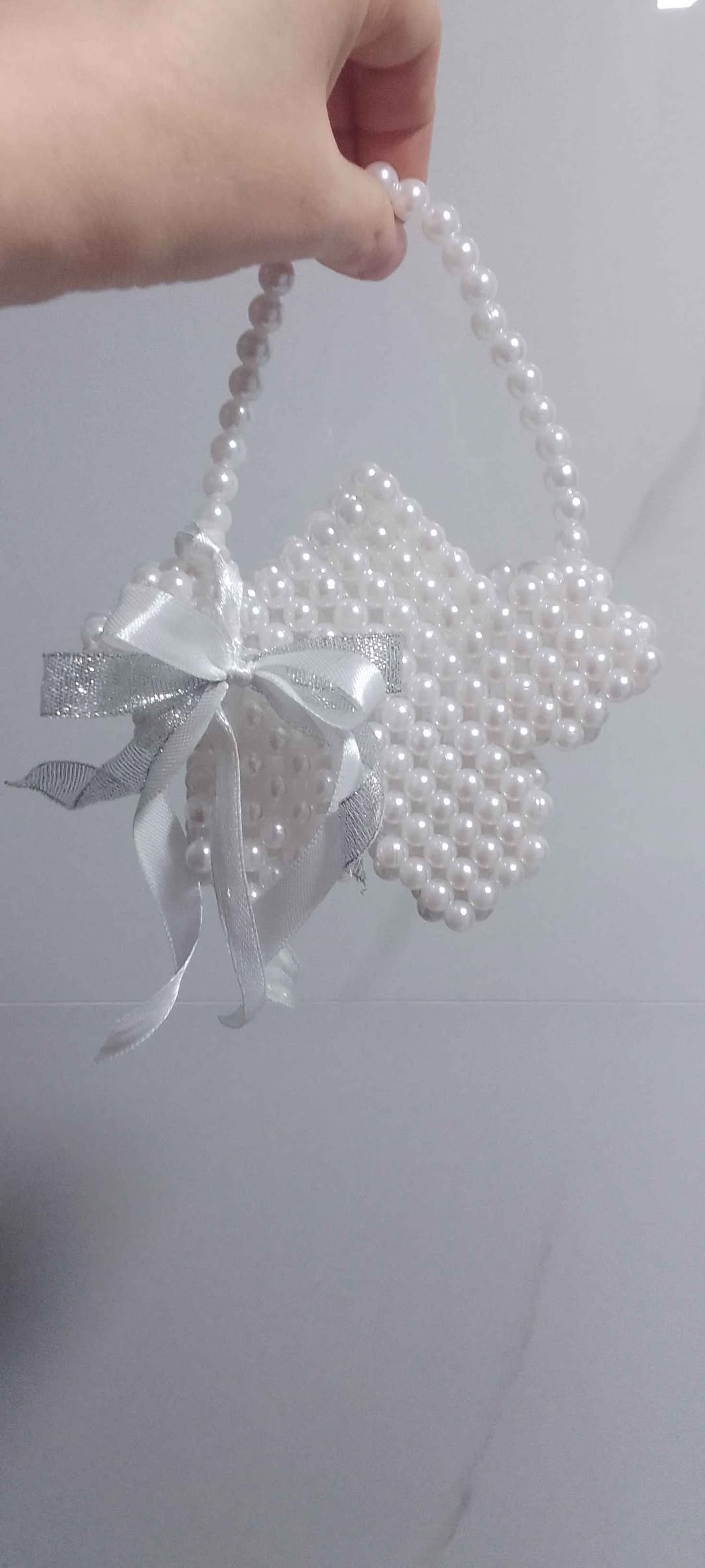 Handmade pearl bag with silver bow