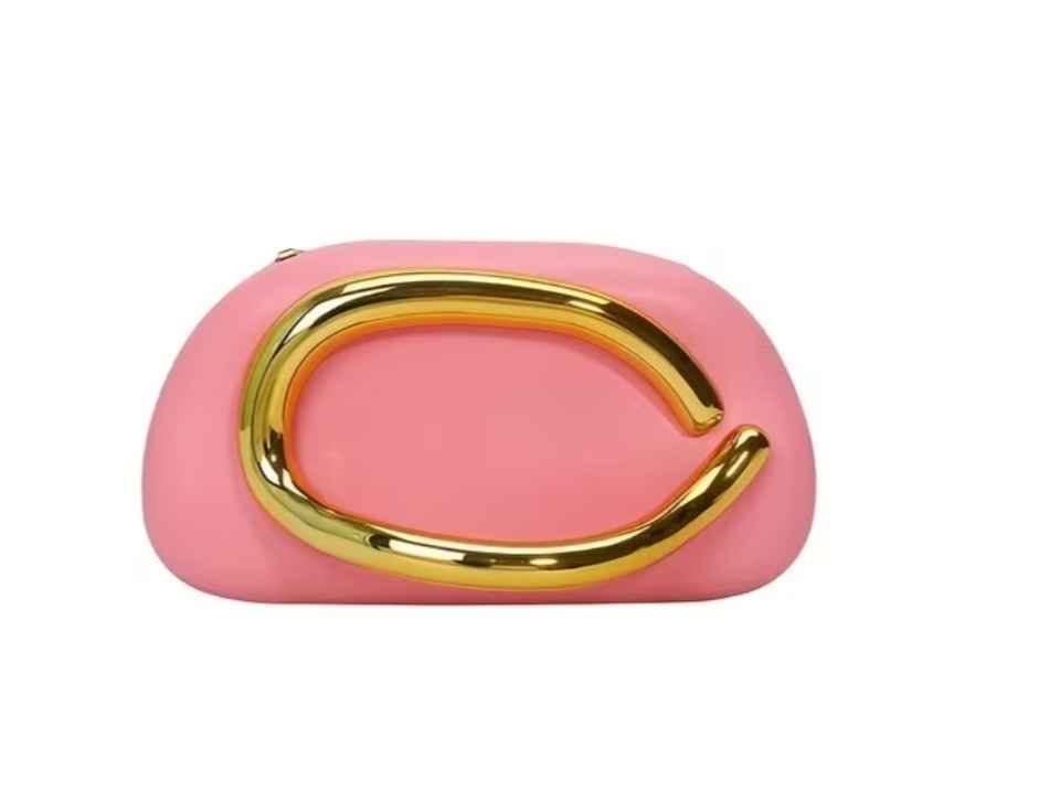 Pink clutch bag with gold handle