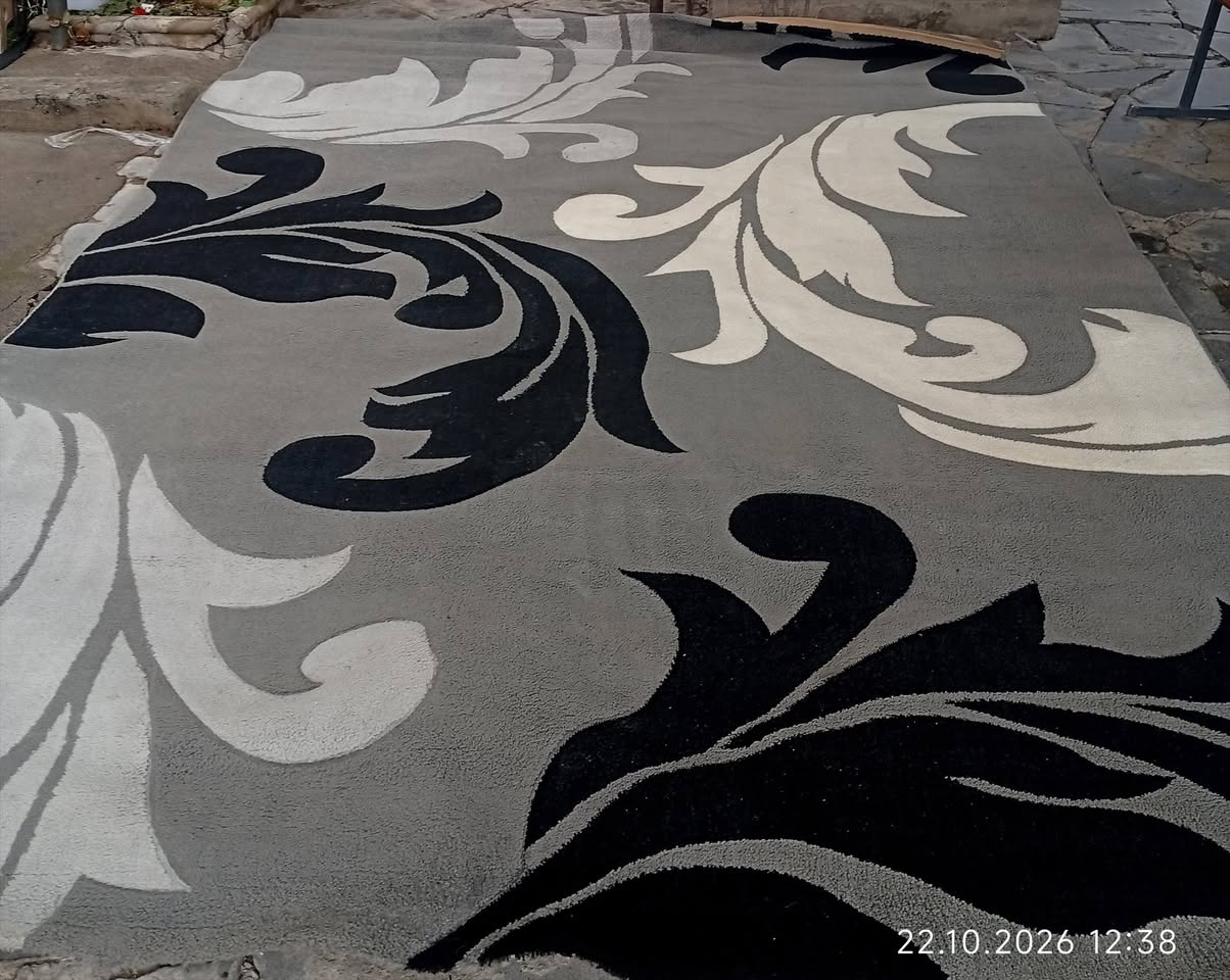Grey rug with black and white pattern