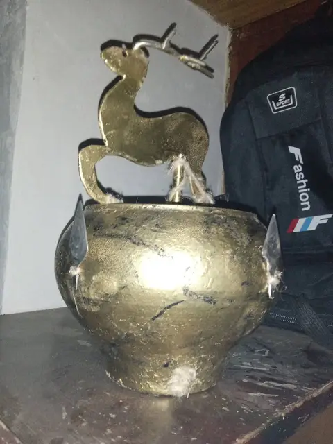 Antique handmade protective deer decoration