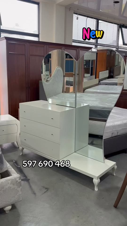 White vanity dresser with heart mirror