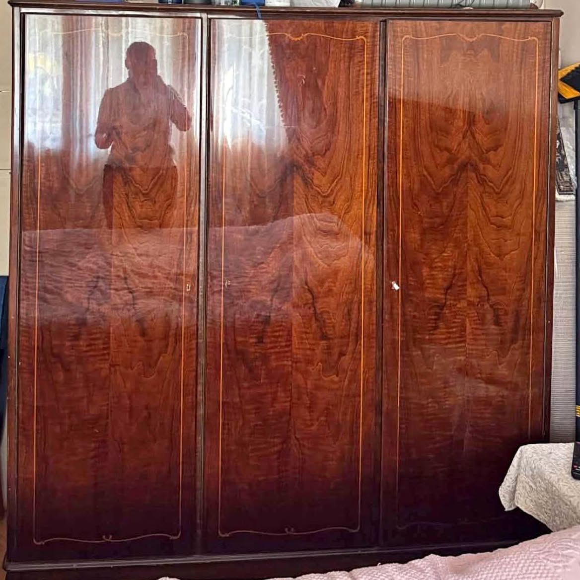 Three-door wooden wardrobe, polished veneer