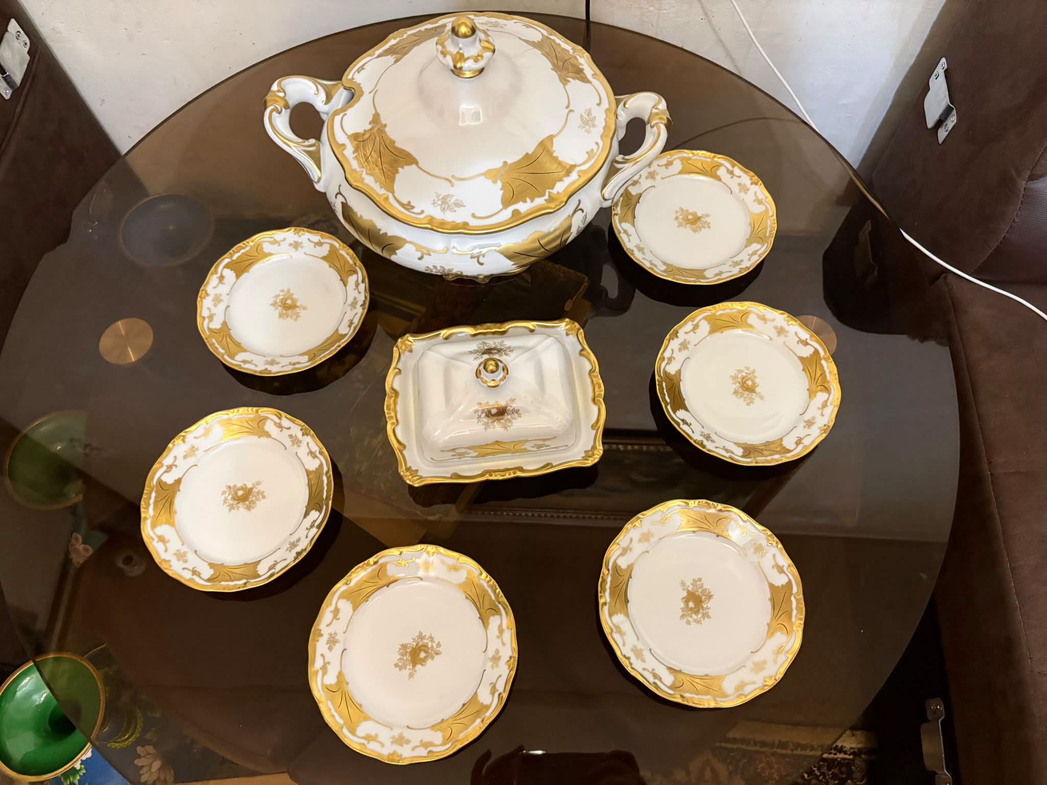 Gold-rimmed porcelain tureen and plate set