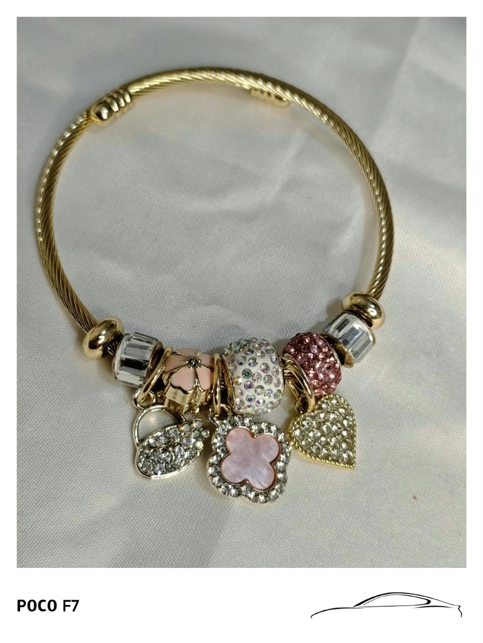 Gold charm bracelet with crystals
