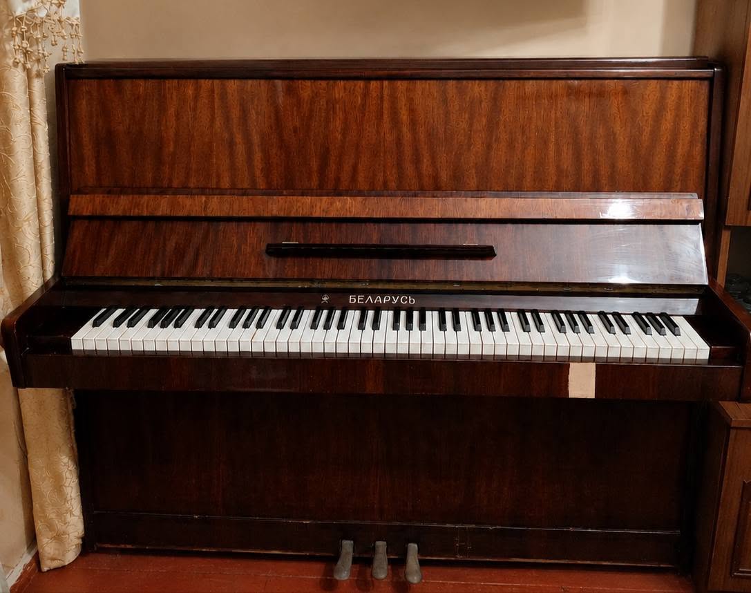 Belarus upright piano with a brown finish