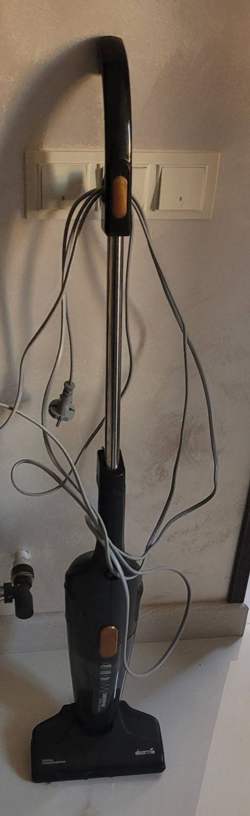 Used black stick vacuum cleaner