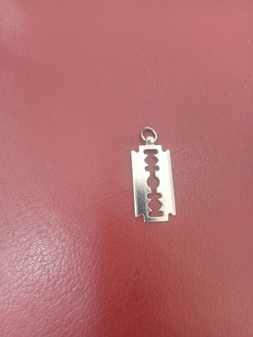 Razor blade-shaped metal pendant
