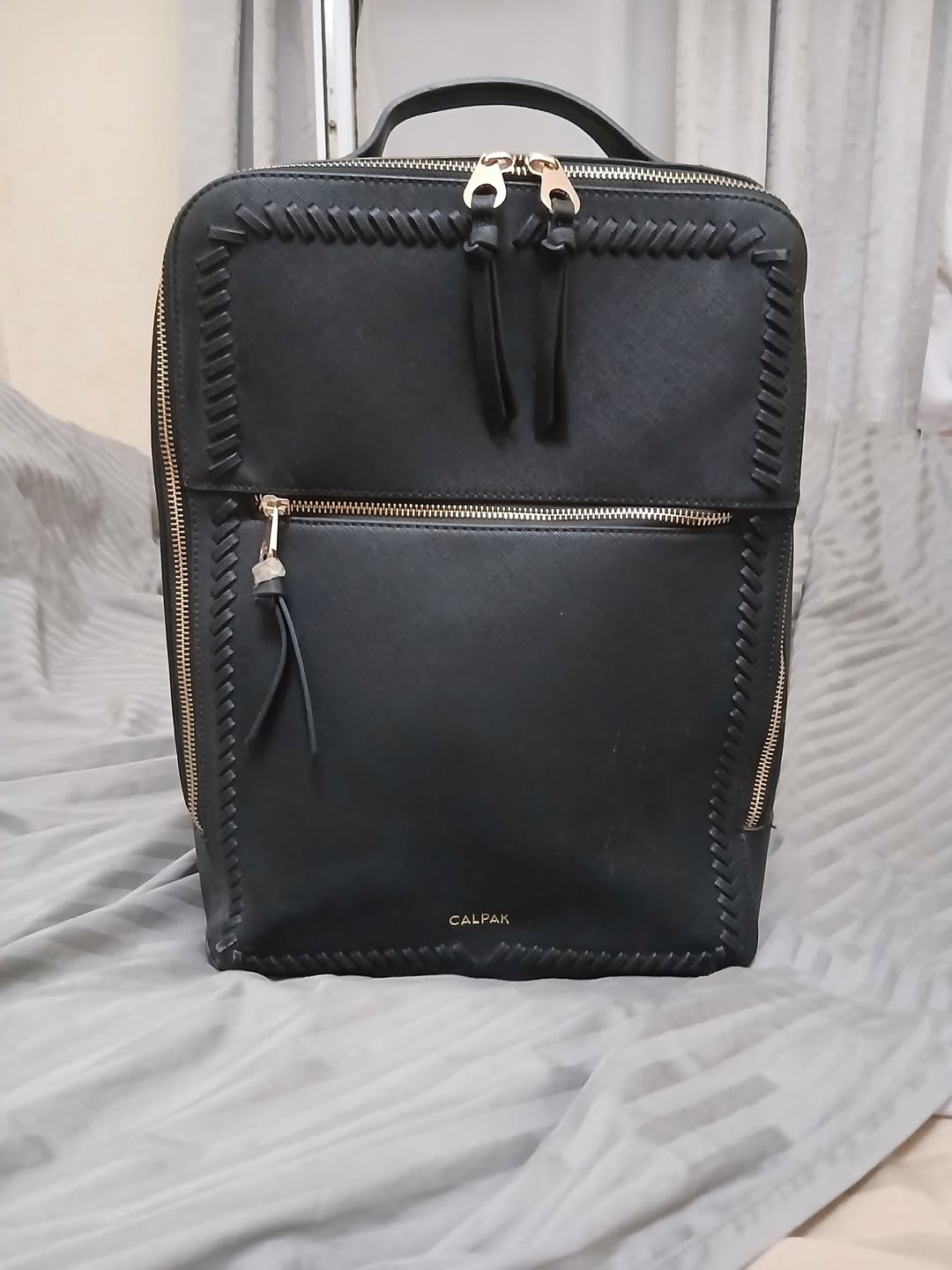 CALPAK black leather backpack