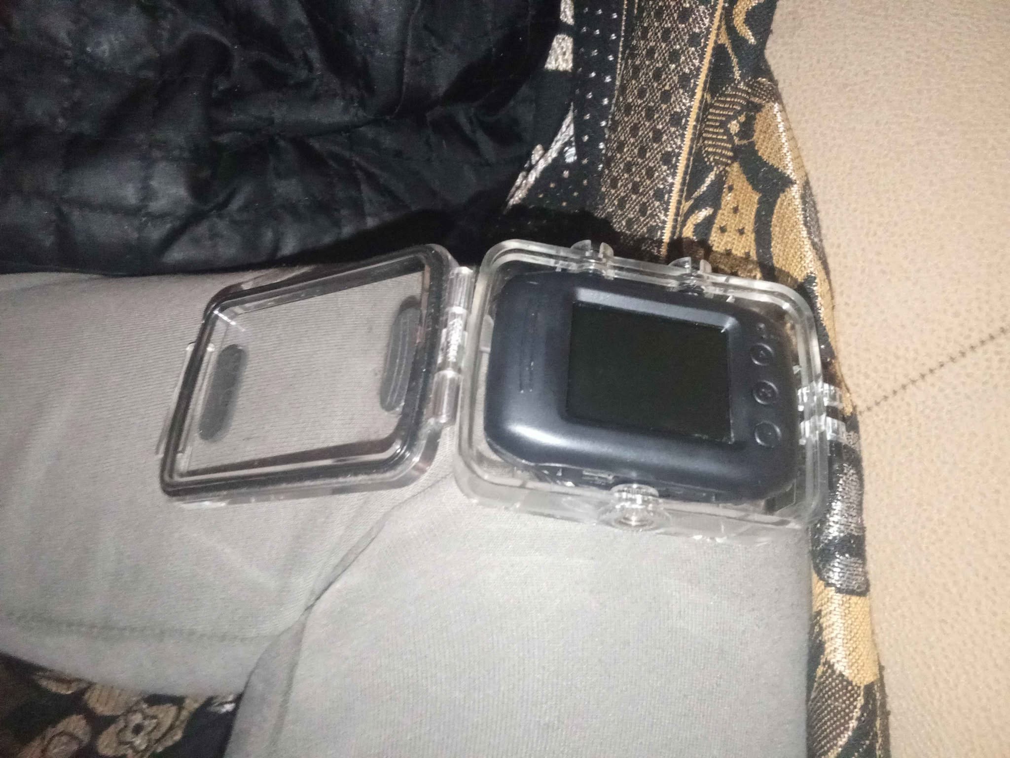 Unused action camera in waterproof case