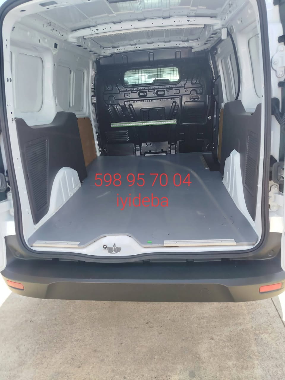 White cargo van with cargo lining