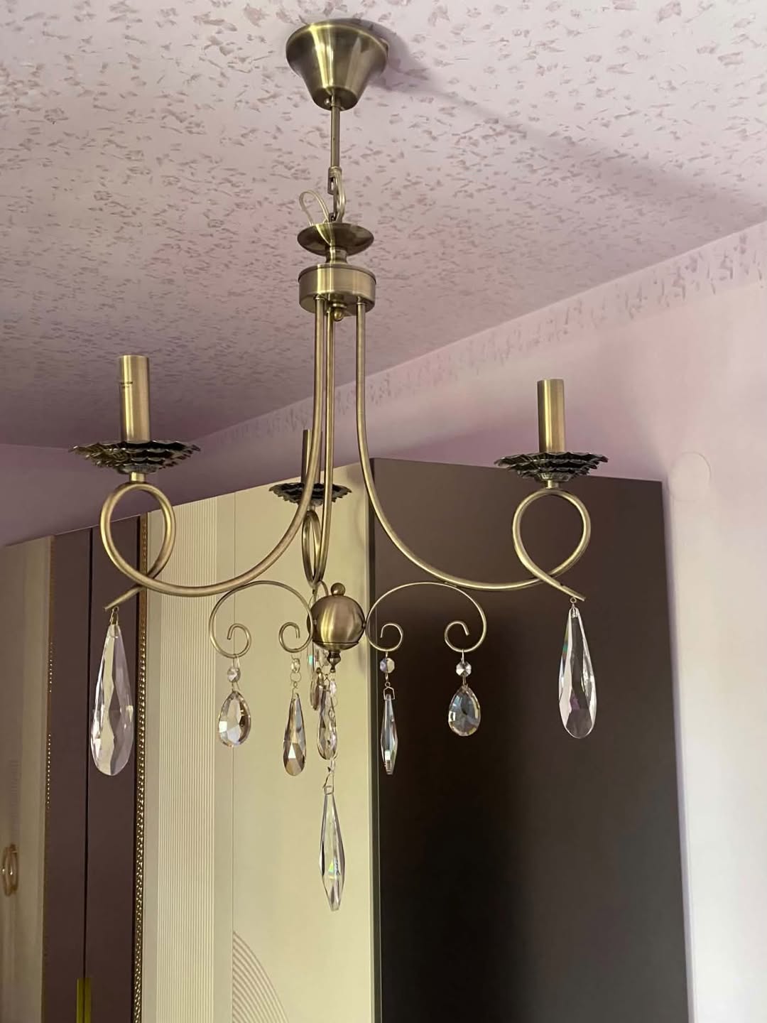Brass chandelier with crystal pendants