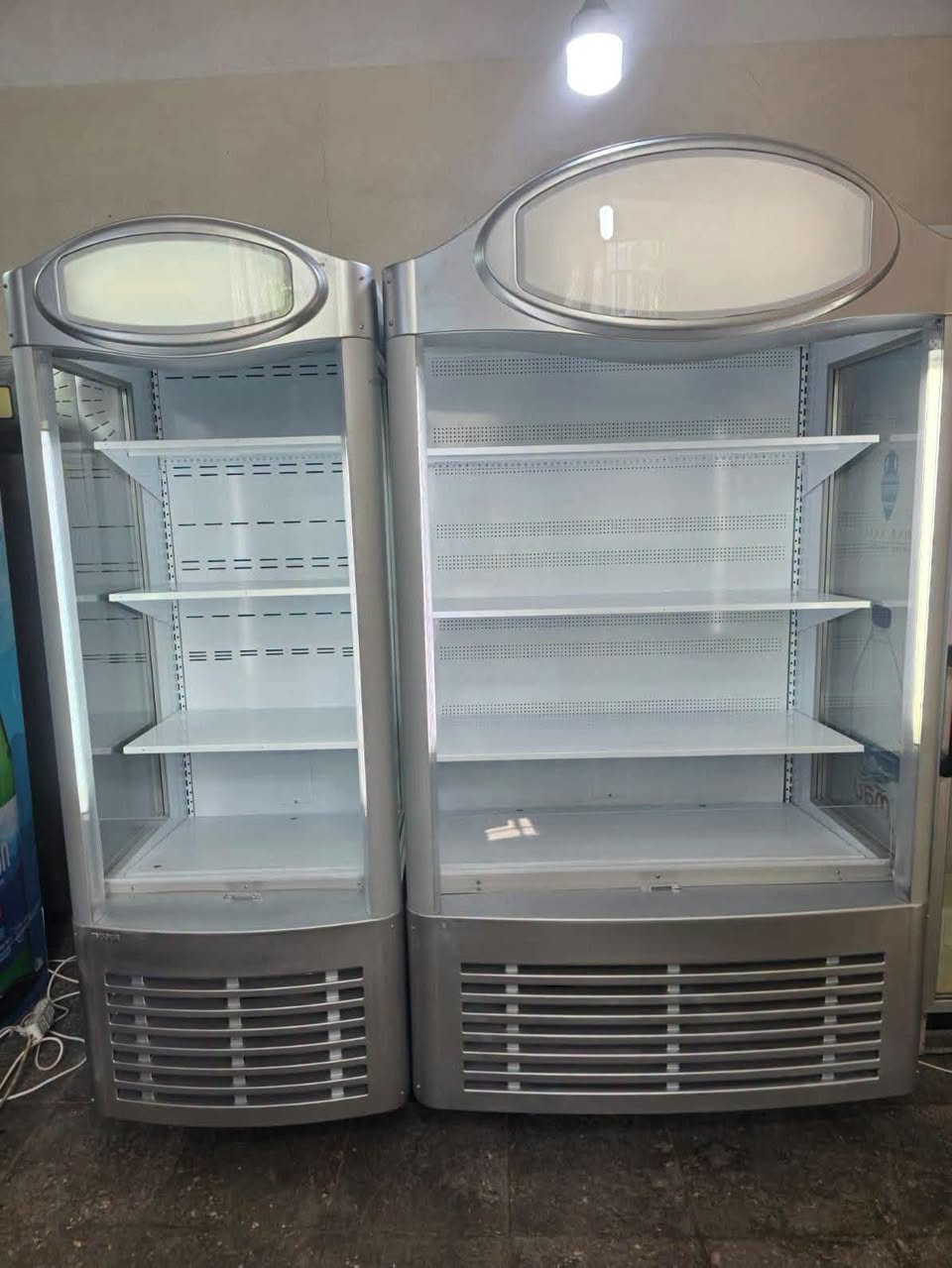 Open refrigerators of various sizes are for sale at the factory