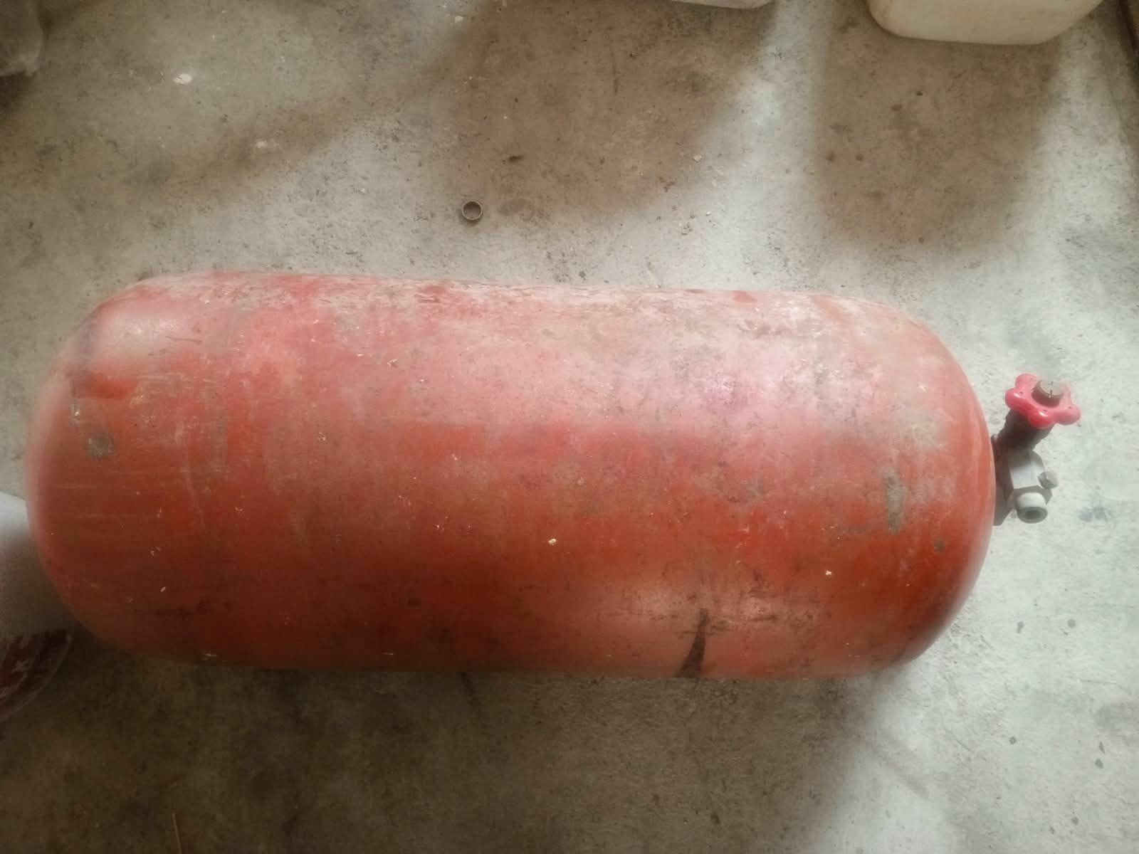 Red gas cylinder with valve