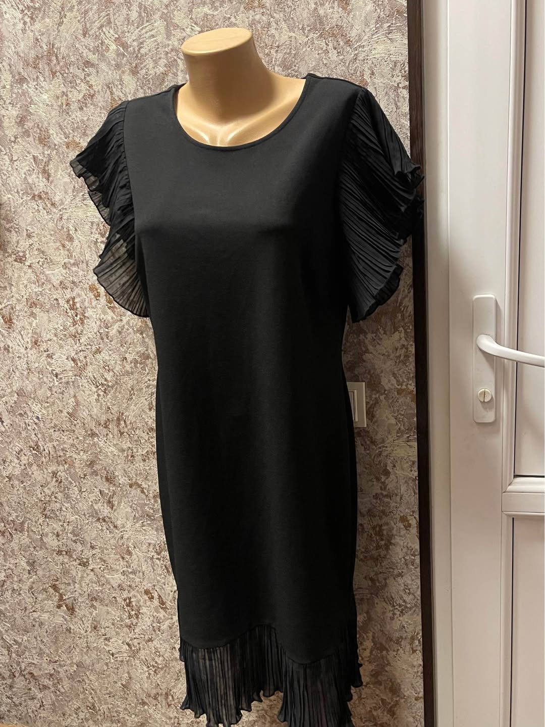 Black dress with pleated sleeves