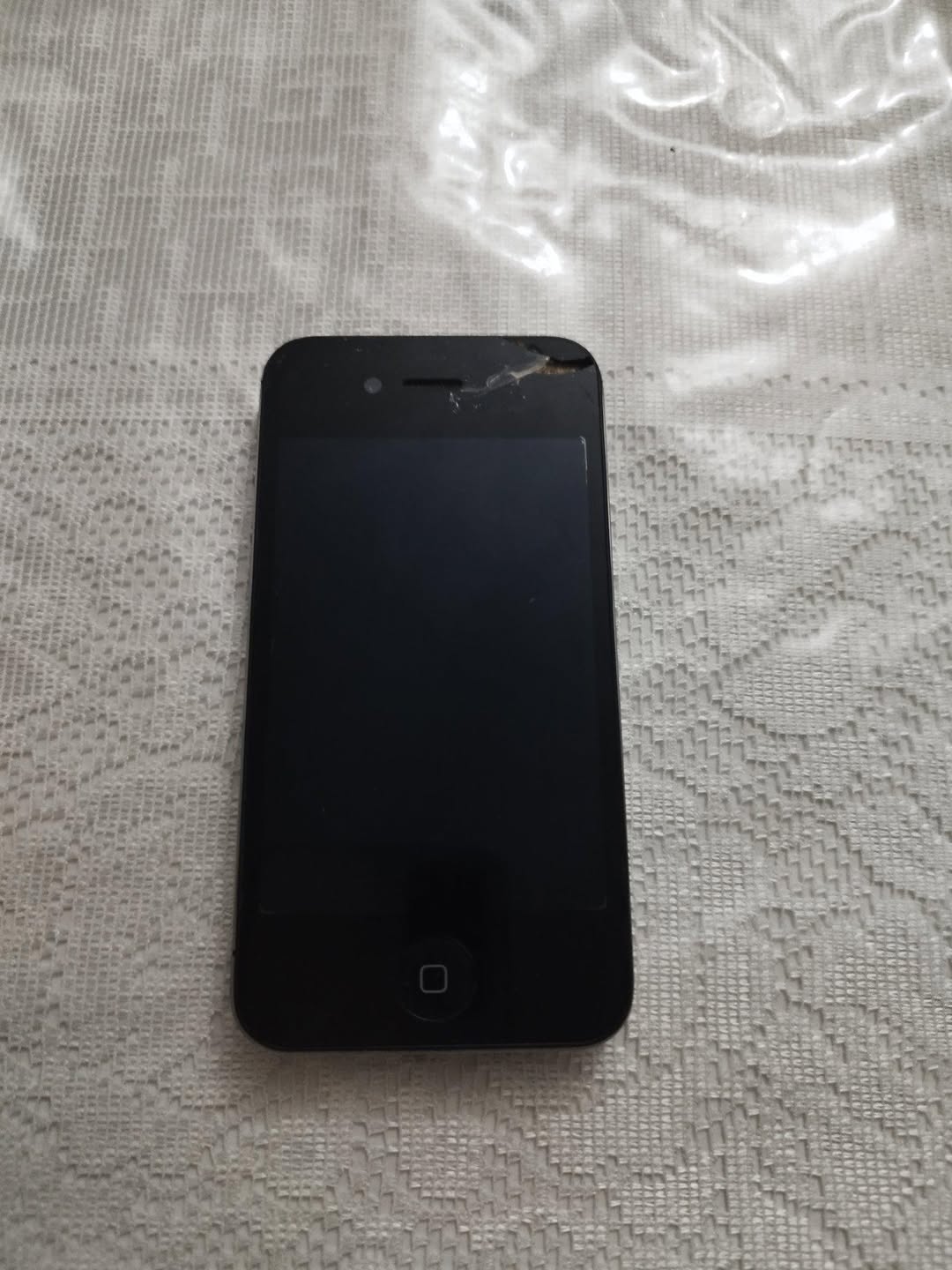 Broken black iPhone, sold for parts