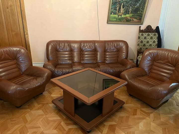 Brown leather sofa set with glass table